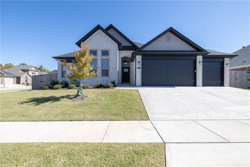 Immaculate and move-in-ready home on a large corner lot! This bright white, all brick home features an open floor plan, hardwood floors, granite countertops, & modern finishes throughout. Off the main entry, youāll find a versatile space with a vaulted ceiling that could be a fourth bedroom or designated office space. Living room includes a cozy gas fireplace and flows to the Kitchen that boasts custom cabinets, stainless appliances, walk-in pantry, large bar, & eat-in dining. Primary Suite with private bath includes jetted tub, double vanity, walk-in shower, & walk-in closet. Additional bedrooms share access to a full bath while a half bath for visitors is located conveniently off the main area. Covered patio is great for entertaining & overlooks a spacious privacy-fenced backyard. Desirable West Fayetteville community, close to schools, shopping, dining, & easy access to I-49. Enjoy the outdoors at nearby Centennial Park, Lake Wedington, or access one of Fayettevilleās many trails just a short drive away.