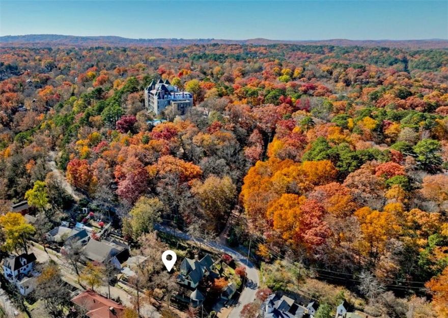Circa 1892, this Queen Anne Victorian is located just down the street from the famous Crescent Hotel and Historic Downtown Eureka Springs. Completely renovated in 1990, the 6 bed, 4 bath boasts 3 levels of handcrafted woodwork, original hardwood floors and light fixtures, stained glass accents, 2 parlor rooms, formal dining, antique pocket doors, 3 fireplaces, and more! 3,538 sq ft plus additional attic space. Professionally landscaped grounds include koi pond, stunning veranda, and wraparound front porch. Detached garage was converted into a studio for long term rental. Featured in HGTV - this is a true work of Victorian art! New HVAC in 2023. Electrical, plumbing, insulation were replaced in 1990. Roof approx 8 years.