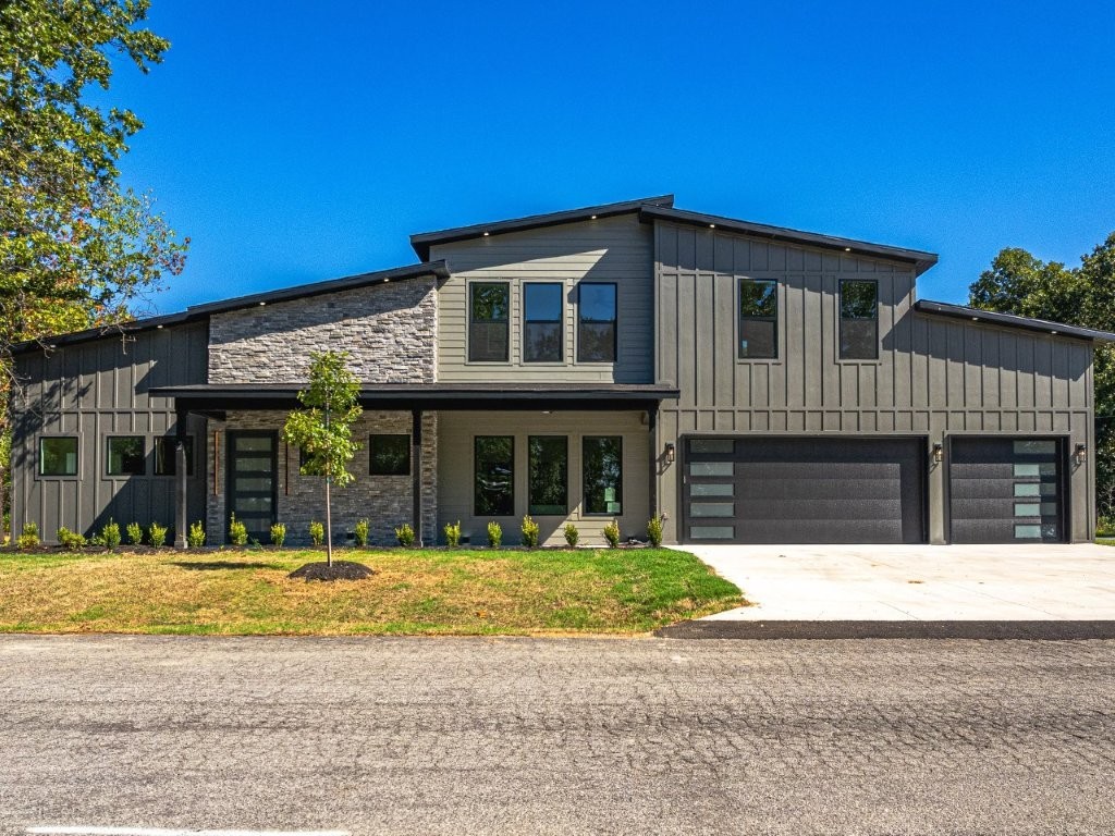 New Construction! Experience luxury living in this stunning new home located in Bella Vista. This impressive 2,200 sq ft residence is situated on a spacious .43-acre lot, featuring a modern open-concept layout illuminated by abundant natural light through large windows. Enjoy cozy evenings by the fireplace or indulge your culinary skills in the gourmet kitchen, equipped with custom cabinetry and stylish quartz countertops. Key Features: - 3 generously sized bedrooms and 3.5 bathrooms, including a luxurious main-floor primary suite - Two additional upstairs bedrooms, perfect for guests, or a home office - Expansive .43-acre backyard, ideal for creating your personal outdoor retreat with a patio -3 car garage Location Details: Located within Bella Vista's popular biking community, just 2 miles from I-49, and in proximity to Loch Lomond Lake and a network of scenic trails. Expected Completion Date: August 15. Nonrefundable deposit of 10,000.