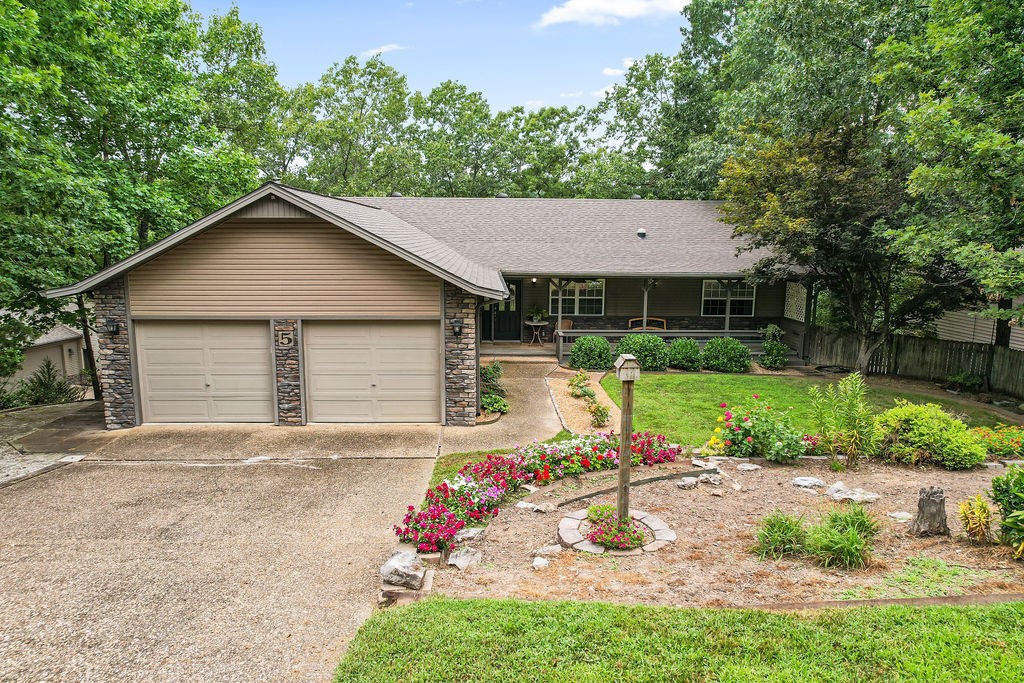 Experience lakeside living on Lake Brittany in this perfectly maintained home with a 10x20 dock and two covered decks overlooking the water. The main floor offers a welcoming layout with two bedrooms, an office, and 2.5 baths, highlighted by quartz counters and updated tile. The lower level includes a second family room, bedroom, and bath, along with a versatile heated/cooled workshop. Surrounded by tiered landscaping, natural stone accents, and a lake-fed irrigation system, this home blends comfort with natural beauty. Approved borrowers will receive a closing cost credit of 1% of the loan amount up to $5,000 on their Closing Disclosure on their loan closing with Envoy Mortgage Branch NMLS #2659248 and Branch NMLS #2579798.