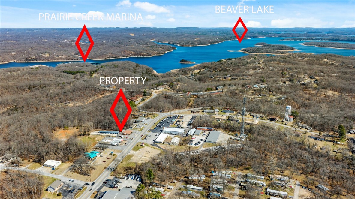 Investment Opportunity! 2 parcels included! 1742 SF restaurant/bar space for sale, currently leased by Fat Chef. Second parcel includes a 40 unit storage building sitting on .67 acres. 8 units are currently leased. Seller has not actively advertised the storage units it has a lot of opportunity to grow! Properties are located off of Hwy 12 in East Rogers! Space includes multiple dining/seating areas, one bar, public restroom, outdoor seating area, and more! New septic in 2022. Located just 1 mile from Prairie Creek Marina on Beaver Lake. Business is not for sale! Please do not disturb tenants!