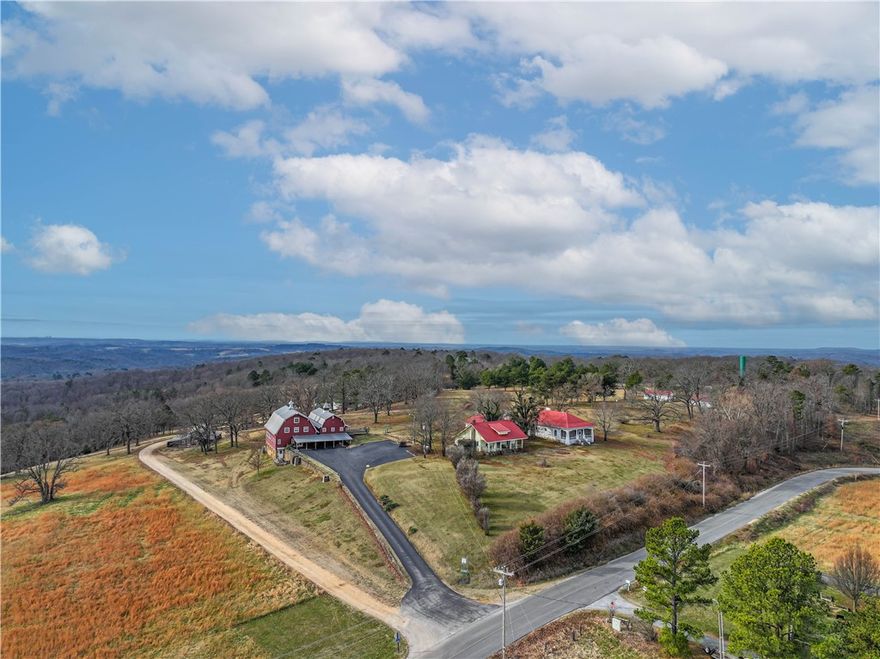 A rare opportunity to own a historic gem in one of the most coveted neighborhoods in Eureka Springs! The property known as Hillspeak spanning over 34 acres is rich in history! The main 10,000 sq ft iconic red barn was a true dairy barn prior to becoming the main printing and processing location of the "Anglican Digest" accompanied with a small beautiful chapel. The time has come to have a new dream brought to life with endless possibilities on this magnificent property featuring 5 living units (former rentals) in addition to the main barn. There are also multiple outbuildings for shop space, storage, etc. A large community well that serves the local neighbors is maintained on site. This property is truly a one of a kind and needs to be toured to fully appreciate the opportunity that exists here. Showings by appointment only to pre-approved buyers. Last chance to keep this iconic property together - survey has been ordered to begin splitting into smaller parcels and listings.