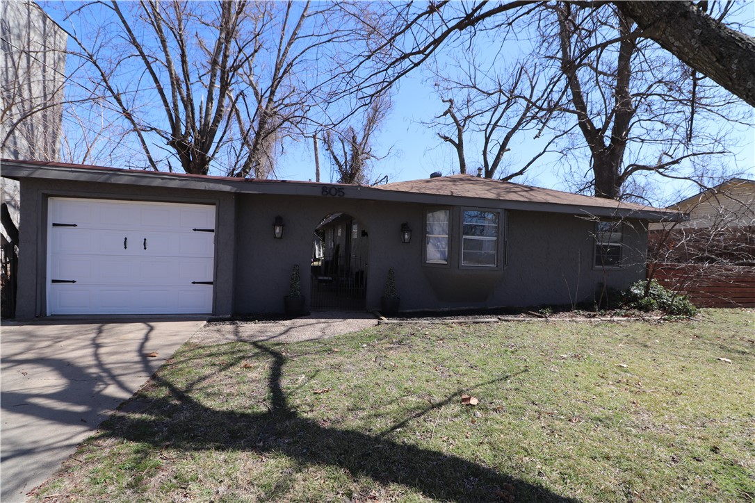 Incredible Bentonville location that is walking distance to The Momentary, 8th St Market, Downtown Bentonville, Razorback Greenway, and the new Walmart home office campus. This home offers 3 bedrooms, 1.5 bath, detached 1 car garage, and a fenced .24+/- acre lot.