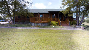 Located just 2 miles from the nearest marina on beautiful Bull Shoals Lake, 25 miles from the great entertainment of Branson, Mo, and nestled in the rolling hills of the Ozarks sits this cedar log house on 15 ac just waiting for you to make it your home. The main house consists of an open living area, ideal for entertaining, an incredible kitchen, dining, living room and large master suite with a Jacuzzi tub in the master bath as well as a walk-in shower & double vanity. The lower level has 3BR, a full bath, & a large utility all purpose room. Plenty of outdoor living on the wooded decks on both the front & rear of the main floor & concrete patio on the lower level. An above ground pool awaits you on those warm summer days & nights. See docs/supplements for more fabulous features.