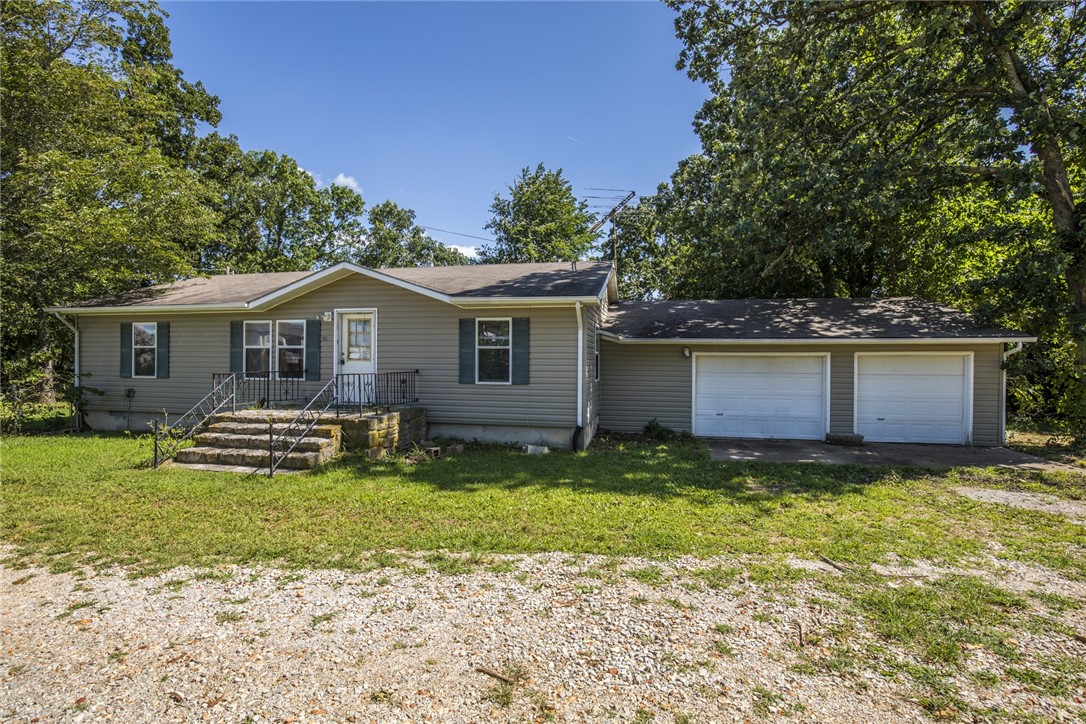 Country setting in Centerton. 2 bedroom 2 bath home on large lot with fenced yard. Fresh paint and 2 car garage.