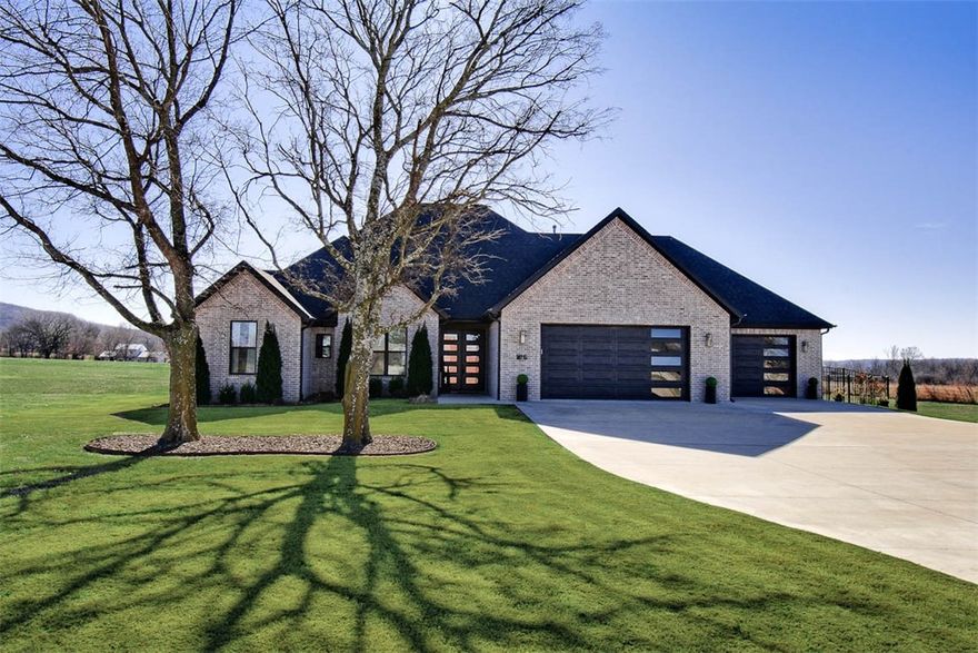 Don't miss out on this beautiful custom built, one level, all brick home located on 1.19 acres with a great view! 2,973 SF, 4 BR, 2 BA with an open floor plan and vaulted ceilings.  The fantastic gourmet kitchen features quartz countertops, soft close cabinets and a large island. The primary suite has a large bathroom and closet plus a private patio. There are many additional amenities plus a hidden safe room. This beautiful home is a must see. Agent owned