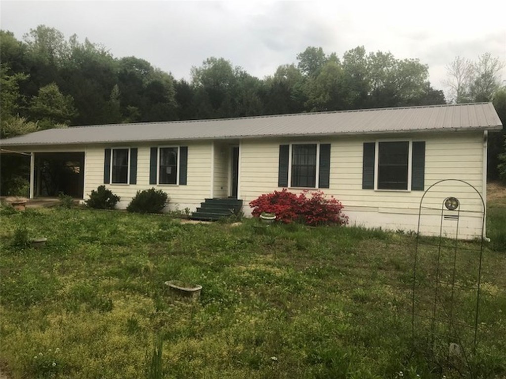 Beautiful Cozy home with lots of potential. Lots of privacy and feet away from the creek. Three bedroom and 2 bathroom, separate laundry room with a half bathroom with exit to the above ground pool. "Seller will not complete any repairs to the subject property, either lender or buyer requested" You must complete release and showing attachments before you will get a confirmed showing.