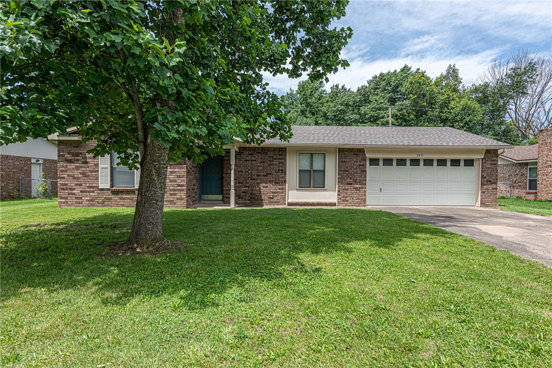 Welcome home! Located just minutes from parks, schools, 1-49, the University of Arkansas, Washington Regional & other medical offices, this 3-bedroom, 2-bathroom gem offers the perfect blend of comfort, convenience, and charm! From the covered front porch head inside to an UPDATED interior! The living room features a brick fireplace, NEW LVP Flooring & and FRESH PAINT throughout. Enjoy an eat-in dining room with bay window feature & updated lighting! Galley style kitchen includes white cabinetry, stainless steel appliances, and plenty of counter space! Relax and rejuvenate in the primary suite with new carpet, with private water closet and walk in shower! Plus two more bedrooms, additional full bathroom, and laundry room with cabinetry! Head out back to the patio and enjoy all this summer has to offer with a spacious and fenced in backyard with 8x10 Storage building! Don’t miss your chance to own this home in a prime location—schedule your showing today!