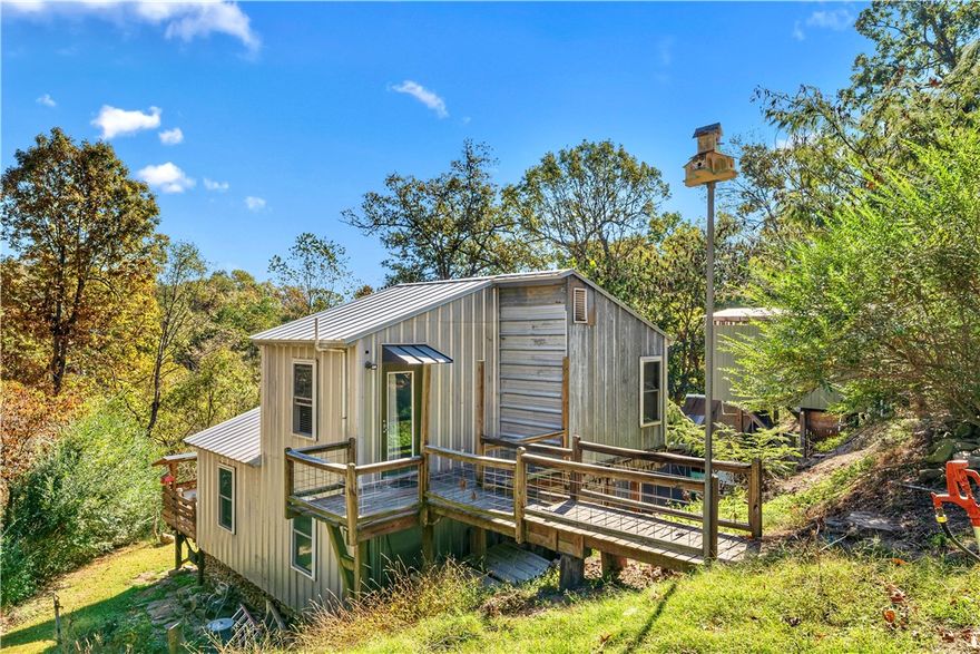 Charming 2-Bed, 2-Bath Home with Lakefront Appeal! Brimming with character and versatile potential, this cozy home is just steps from the serene shores of Beaver Lake. Whether a first-time buyer, single person, a small family, or an investor, this property offers versatility to suit your needs. Key features include a detached woodshop – perfect for projects, storage, or play. Ample space to expand or reimagine the layout to your liking. Solid bones with plenty of charm and room for a fresh start. With its novelty appeal, this home is a great opportunity to create something special. Don't miss the chance to own a piece of lakeside living!