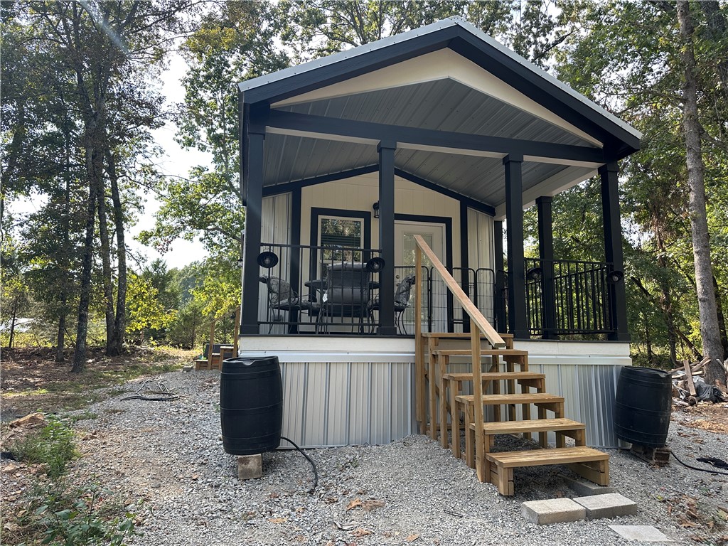 Escape to the country with this adorable new tiny home on 10+ unrestricted acres! This property is fully set up with brand-new appliances, a private well, RV hookups, fencing, pond and even a generator—making it the perfect turn-key retreat. The home is built with metal roof and walls for durability and low maintenance, and everything stays so you can move right in. Whether you’re looking for a VRBO rental, hunting camp, summer getaway, or a full-time country escape, this property checks all the boxes. With ample room for hunting on your own land and the infamous White River nearby for world-class trout fishing, the possibilities are endless. Don’t miss your chance to own this rare find—luxury living in the country with endless potential! This one won’t last long!