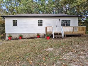 Wonderful country setting on 2 acres m/l approx 10 min from Wal-Mart. Adorable home completely remodeled, move in ready & perfect for the 1st time home buyer. Full unfinished basement. Some updated includes new HVAC, new siding, new back deck, new stainless steel appliances, new flooring, paint, kitchen, bath and the list goes on. All #'s are approx, age is estimate, sq footage per assessor.