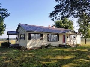 Beautiful setting for this 3BR/1BA home with great views of surrounding Mountains. Enjoy beautiful sunsets from the tree shaded yard. Home has a nice open feel with a large fireplace, new metal roof, fresh paint, and on paved road. Age of home is estimate. Seller has added new Central heat and air.