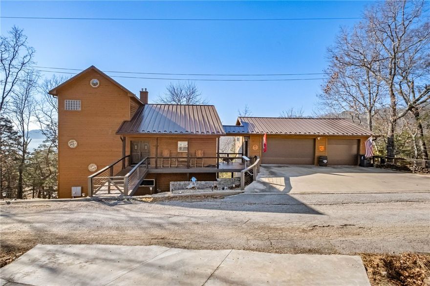 Incredible opportunity to own this gorgeous three-level cedar home on 3 lots overlooking Beaver Lake! Enjoy majestic lake views from the home and three decks, just minutes from Rogers and Eureka Springs. This home features 3 bedrooms, 3.5 baths, an open kitchen/living/dining layout, granite counters, walk-in closets, and ample storage. The lower level offers a second living area with a full wet bar, perfect for entertaining. An additional 918 SF heated and cooled man cave/storage is not included in total SF. Three-car attached garage, two-car detached garage, plus parking pad. Community amenities include a nearby Recreation center with fitness facilities, pool, and courts. Seller offering buyer incentives for rate buy-down. All furniture and appliances convey! Ideal as a primary residence or vacation home.