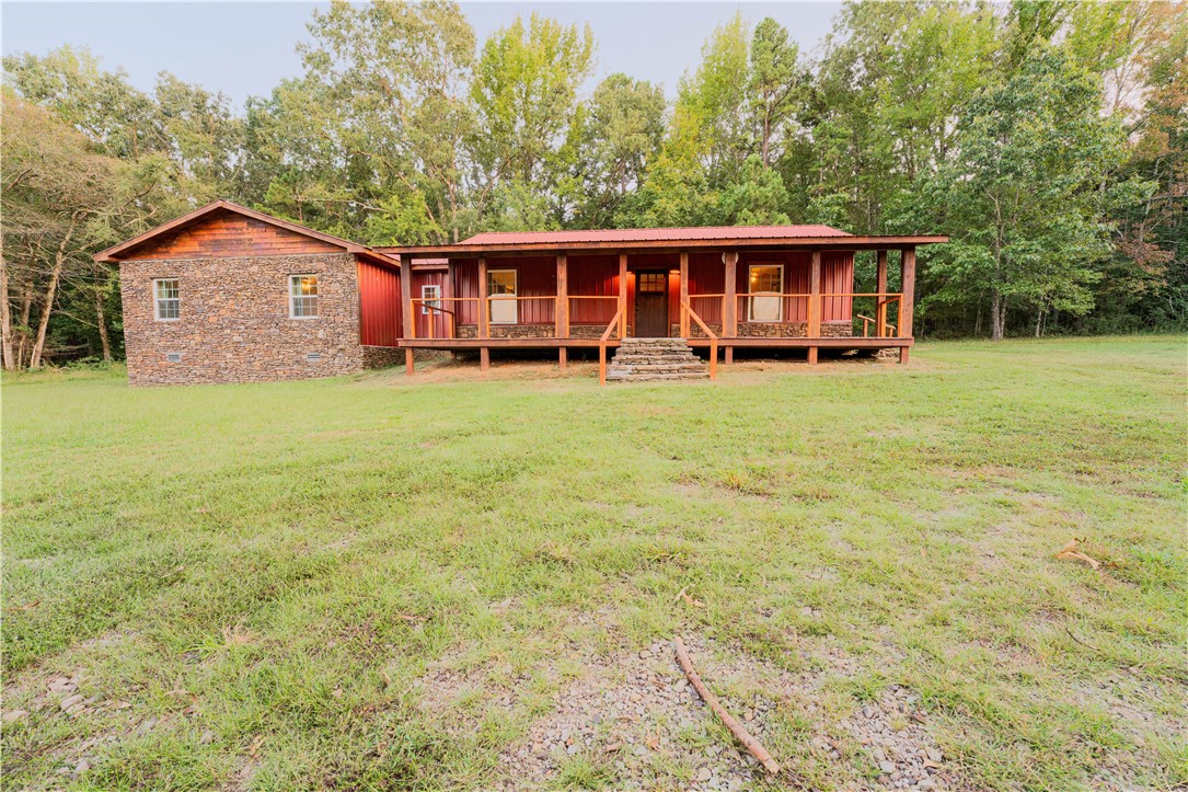 Beautiful perfectly situated House on 17 private and gorgeous acres! Step up on the large stone steps on to a completely refinished deck to enjoy the wildlife wandering into your front cleared yard surrounded by forest to seclude you in your own oasis. Step into a cabin atmosphere that offers to big rooms complete with large bathrooms with the master having extra room to fit in an office or exercise area. Going into a huge bathroom with a stand alone bathtub and double faucet shower! Two huge closets on either side! While you are soaking in the large bathtub enjoy the beautiful outdoors through the large window situated next to it! The open concept of the country kitchen/living room instantly makes it feel like home! The 17 acres offers a detached garage/shop and 2 fenced areas for animals of any kind! Off to the side is a wide open space to use for whatever your dream is! With a functioning well if that dream includes a garden!