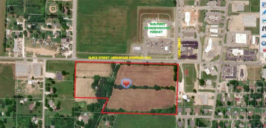 Next door to the new Walmart Neighborhood Market.  Commercial frontage and residential single-family or residential multi-family. House and outbuildings hold no value.