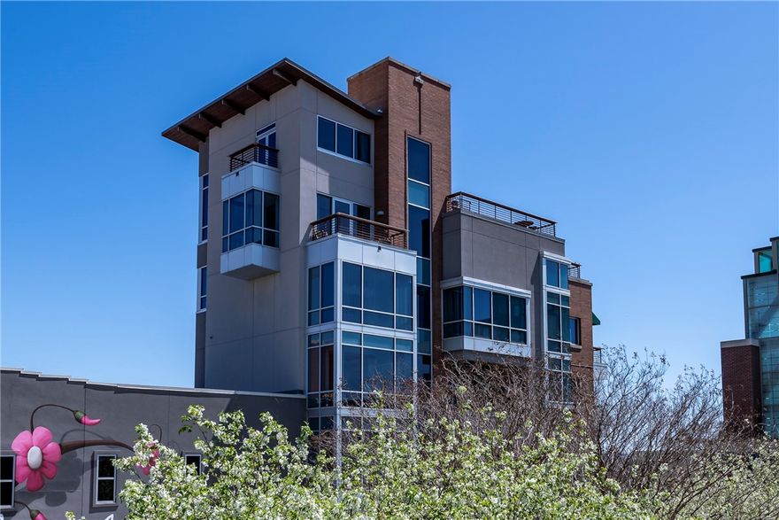 Rare opportunity to rent a 3,870 SF luxury condo located directly on the Fayetteville Square. This residence privately spans the 4th through 7th floors and sits adjacent to the Fayetteville Convention Center, offering unmatched access to downtown dining, shopping, and entertainment. The condo features two bedrooms, three full bathrooms, and one half bath, along with a loft, dedicated bar room, and an expansive living room with fireplace. The kitchen and dining area open to a sunroom with an additional fireplace, creating an ideal space for entertaining. Multiple patios are included, one of which is directly accessed from the primary bedroom. The primary suite also offers two walk in closets and a private retreat feel. Floor to ceiling windows provide panoramic, 360 degree views of Fayetteville. The property includes a private garage with elevator access directly to the condo. Modern finishes are featured throughout, including updated appliances, lighting, fixtures, and flooring.