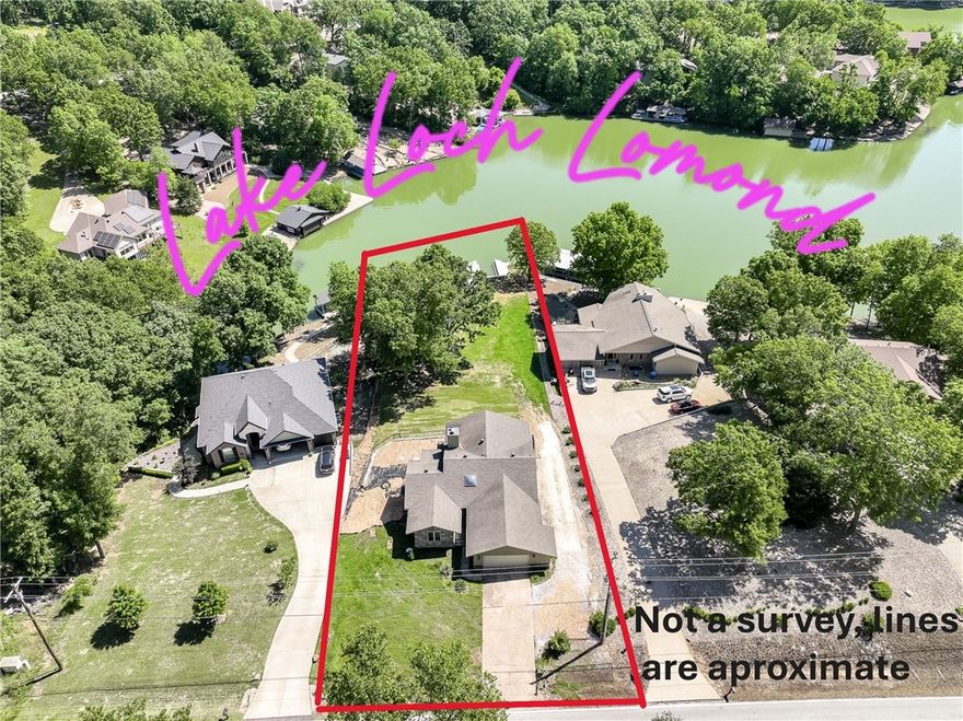 Price Reduced! Enjoy easy access to the water with a gentle walk across the grassy lawn to your Lake Loch Lomond paradise! This property offers approximately 100' of shoreline, a brand-new seawall, large patio, and dock—ready for you to personalize into your lakeside retreat.  With aprox 2,600 sq ft of living space, this home includes two spacious living areas, up to four bedrooms, and plenty of room for relaxing or entertaining. The finished sunroom features a new mini-split system for year-round comfort, while the large, East facing, covered decks provide stunning lake views. A detached lakeside storage building—complete with electricity—offers tons of potential for a workshop, studio, or lake toy storage.
Don't miss out on this rare opportunity to own a true lakefront property on Loch Lomond—listed under $1M!