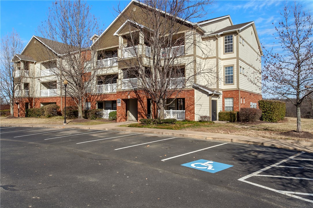 Busy lifestyle? Free yourself from property maintenance with this wonderful 2 bedroom condo in pristine condition. Conveniently located next to Fayetteville Mall with an abundance of property amenities to offer -from the advanced workout facility and large clubhouse to the beautiful pool. Condo features vaulted ceilings, hardwood floors in main living areas, eat-in kitchen with granite counters and stone back-splash, bedrooms with walk-in closets, balcony with extra storage closet and private view! Within minutes from I-49, restaurants, shopping, movie theater, trails and more! Vacant and available for immediate occupancy!