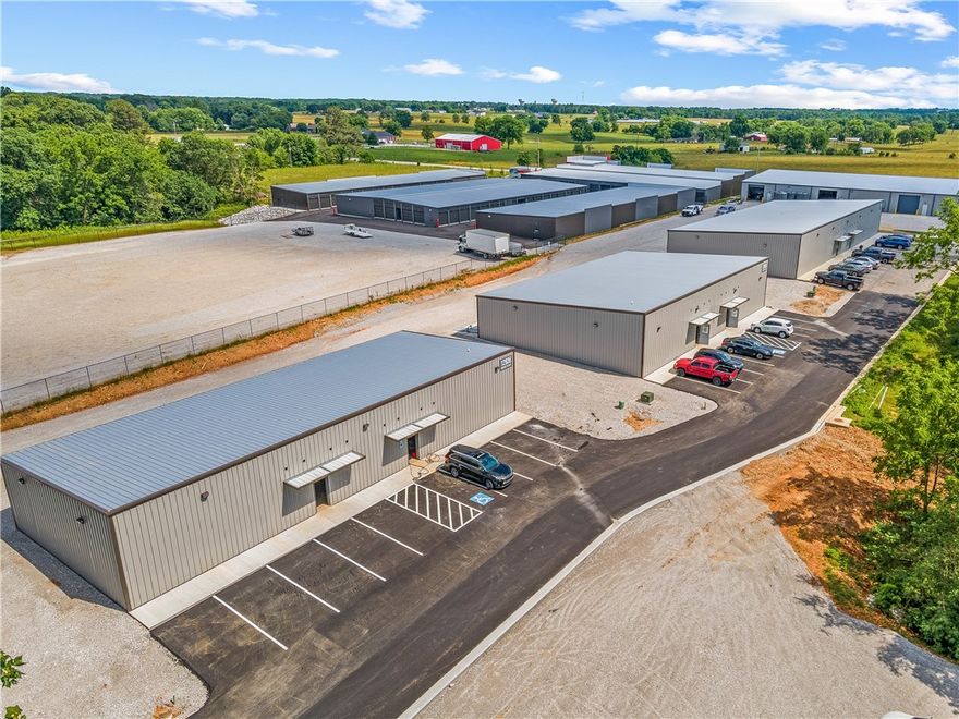 Your flex space solution.  With immediate availability and under 2 minutes to the bypass, Grant Place is your premiere location. This open floor flex space with roll up door, dock access, paved parking lot, shop sink, and two piece bathroom provides the space and flexibility you need. Perfect for wood working company, pest control, trade businesses, auto detail, or shipping business. Minutes from anywhere you need to be in NWA. Come grow your business with us.