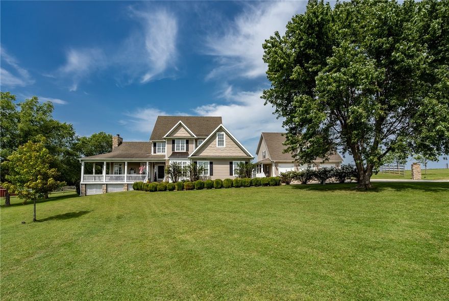 Your own piece of Southern Living. This home looks like it stepped straight out of the pages of the
magazine! With 5 beds, 2.5 baths and over 3,600 sf in the beautiful main home, you will enjoy watching the horses graze and the sun come up from the wrap around porch on crisp fall mornings. Complete with office space, a craft or reading nook, walk in closets, and generous entertaining areas, this is a welcoming Arkansas home at it's finest! In the well appointed guest home, you will find an open floor plan with room for grandparents,a place for the kids to stay when they visit or potential rental income! The downstairs bath is handicap accessible and the upstairs you will just have to see it to believe. In addition to the upper living, bed & bath, there is an incredible walk-in attic storage area that could easily be finished into add'l living space. Outside find a 4-stall horse barn, chicken coop, fruit trees, blackberry bushes, and RV pad w hookups! So much to see & appreciate! Don't let all this charm slip away!