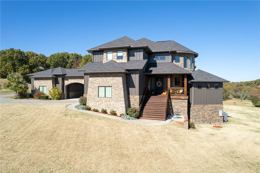 Located behind a private gated entry, this meticulously custom built home boasts panoramic views of natural beauty with an Outdoor Oasis.  The outdoor space is an entertainers dream with nearly 2,000 sq ft of patios & cedar decks!  Guests can swim in the sparkling saltwater pool or cuddle up to a fire by the Outdoor Fireplace or the Firepit! Inside light pours thru the windows enhancing every room including the Chef's Kitchen beating as the heart of this home with professional series appliances! An open floor plan offers a family room w/floor to ceiling stone fireplace, dining area, wet bar with ice maker, screened in patio, mudroom w/pet shower & 2 powder rooms all on the main floor. The basement renders a safe room, media room w/projector, game area, partial kitchen, bonus room & MIL Suite. Follow the exquisite winding staircase up to a Primary Suite & luxurious bath on the upper floor, 2 bedrooms, 3rd bedroom w/built ins used as a current art/craft room & full guest bath! Ready to call this one home? Call today!