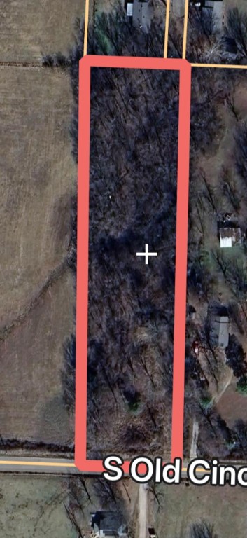 Small acreage and close to town.....like apple pie and ice cream, the perfect combination!! Heavily wooded lot with paved road frontage. Bring your dream and a chainsaw to carve out your very own master piece. Long and narrow lot gives plenty of room to build back away from the road and hide from the rest of the world. Custom home or small farmstead, the possibilities are only limited by your imagination. City water tap on property, electric and gas at the street. Buyer to satisfy themselves with utility tie ins.