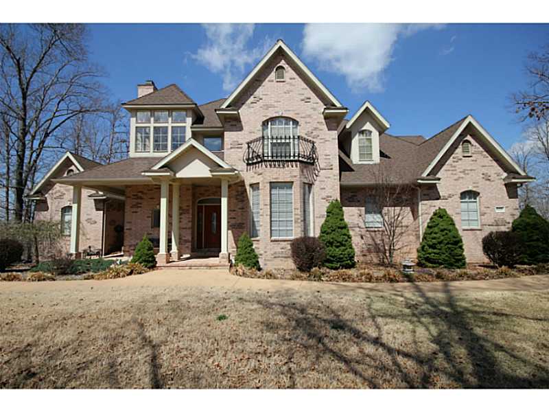 Lake Front / Lake View Estate Home on 2.5+ acres in Exclusive South Mountain Estates Gated Community with 1 slip in the Community Dock. Best of both worlds - Lake Front / Living but Close to town. Three levels, Four garages, Huge Deck, Large rooms...