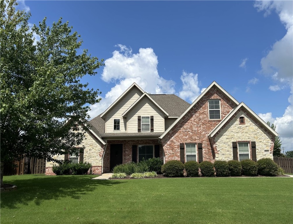 Gorgeous one-owner all brick home in desirable Lexington subdivision! Great size corner lot with side-load 3 car garage. Fairview Elementary school and the Razorback Greenway are steps away. The primary bedroom and bathroom suite are located on the first floor, along with a convenient half bath.
The cozy living room with upgraded surround sound speakers centers around the gas fireplace. The ideal chef's kitchen overlooks the back yard. There is a separate dining room for larger gatherings. The remaining bedrooms, a full bath, large bonus room, and walk-in attic space are upstairs. The beautifully landscaped backyard has outdoor speakers, a sprinkler system, and a custom-built shed for additional storage. This home resides in a family friendly neighborhood and is just minutes away from the interstate, Top Golf, the AMP, Promenade Mall, and many NWA dining spots- this one won't last! Schedule your private showing today.