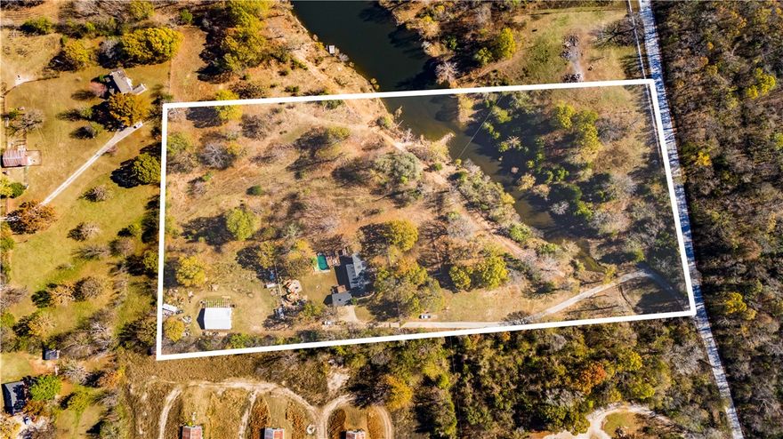 Gorgeous & hard to find homestead or estate property! This beautiful home and farm includes a 7 acre shared lake, numerous raised beds for veggies and fruit, there are several established fruit and berry trees. The backyard is a parent and kiddo paradise of it's own.. a beautiful semi-inground pool, built in splash pad and an amazing playground with forts, tunnels, slides and climbing walls. There are bunny and chicken hutches that can stay if desired. A large shop with lean-to in progress. And yes, you and the couple neighbors share your own private to you all lake for fishing, swimming and relaxing. Plenty of room for cattle and/or horses, as owners have currently. All of these county amenities, yet so close to town, Don Tyson School of Innovation and Park, stores and shopping as well as a short drive away from Beaver Lake public use area. 
If only partial land desired, Owner is willing to do a lot split and adjust price accordingly.
Also see listings separate mls listings #1292729 #1292727 #1292714