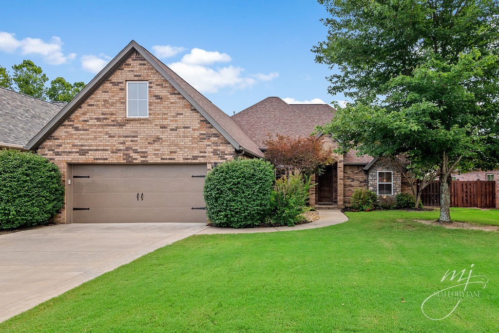 You’ve got to see this beautiful brick home in Rogers close to schools, trails, and shopping! Wonderful living areas include 3 bedrooms, 3 full bathrooms, an upstairs bonus/media room, and 12’ ceilings in the shared spaces. Spend your time relaxing in the fenced backyard beneath the covered patio soaking in the five person hot tub because this home is easy to maintain! New roof in March 2020, newer tankless hot water heater so you never run out of hot water, LG appliances, and irrigation for the landscaped lawn. Take advantage of the nearby Blossom Way Trailhead for access to cycling and running trails, an 8 minute drive to Promenade Mall, and an exclusive neighborhood playground. See it today!