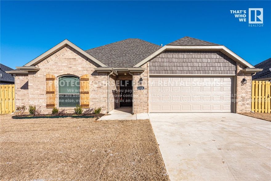 AVAILABLE NOW! Come check out this beautiful 3 bedroom 2 bathroom home located just minutes away from shopping, eateries, schools, and a short drive to the University of Arkansas! Head inside from the partially covered front porch into the spacious living room with a gas log fire place, ample natural light, and a ceiling fan! Flow into the kitchen highlighted with a tiled back splash, lots of cabinet space, an island, a pantry, granite countertops, and stainless steel appliances! Check out the primary bedroom and private ensuite with a double sink vanity, walk in closet, and whirlpool bath tub! Relax and relish in the fenced in backyard under the covered back patio! ***McNaughton Real Estate marketing & applications only, management and lease provided by another party.