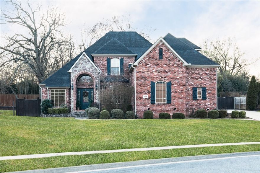 Meticulously maintained 3,637 sq ft home in East Fayetteville’s exclusive Covington Park. This 4-bed, 3.5-bath residence features a chef’s kitchen with granite countertops, coffee bar, beautiful cabinets and cooktop gas hookup for easy upgrading. The layout includes a spacious formal dining room, office with built-in desk and book cases, and a living room with a stone fireplace and custom built-ins - tons of natural light. The main-level primary suite offers private patio access, a spa-like bath and huge closet with ample hanging and flat spaces. Upstairs hosts a secondary suite, large bonus room, Jack-and-Jill bath and two additional bedrooms. Enjoy an expansive 30' covered patio with stamped concrete and private back yard. Recent updates: Roof replaced 2020, downstairs HVAC (2022), gas water heater (2021), and high-efficiency lighting/detectors (2025). 3-car side-load garage, plumbed for central vac, and wired for surround sound.