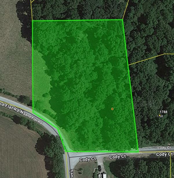 Corner lot, wooded on paved road with water & electric available. Great building site in established neighborhood. No mobile homes allowed.