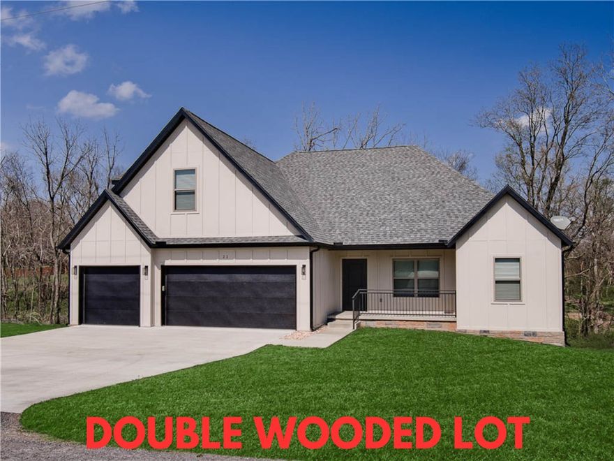 Discover this stunning home set on a spacious .50-acre wooded double lot! Ideally located just down the street from Highlands Golf Course, with quick access to Lake Loch Lomond’s boat launch, trails, and I-49. Built in 2024, this beautiful property features tall ceilings, 4 bedrooms, 2.5 baths, and an oversized bonus room which offers versatile living options. The 3-car garage provides tons of space for vehicles and storage. Enjoy the large kitchen with custom cabinets and a walk-in pantry! High-end finishes throughout! Step outside to the huge covered deck, perfect for entertaining family and friends in a serene setting. Plus, take advantage of $3,000 in buyer's closing costs, courtesey of the seller's preferred lender. Don’t miss your chance to own this exceptional home!