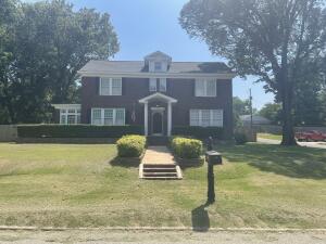 This Historic Colonial Revival Home, known as the Irving House, was built in 1926 and is on the National Register of Historic Places. Full of architectural details and charm, this home boasts a Large foyer, Formal Dinning Room, Large Living Room with Fireplace, Sunroom, Home Office with Fireplace, Eat in Kitchen, 3 Bedrooms, Primary bedroom with Walk-in Closet, Two Full Baths Both recently remodeled, New Flooring throughout, New Paint throughout, HVAC done 2016, Water Heater & Dishwasher 2018, Fridge and Gas Stove Top 2023, New Roof 2019, Solar Panels 2020, All new plumbing 2023, High Ceilings, Detached two car garage with unfinished Mother-in-law suite/Mancave behind Garage. Property is in Conway County and South Conway School District. Motivated seller.