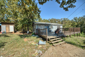 Owner Financing now Available with $2,000 down and less than $200 a month!864 sq ft home on 1 acre of land. This home has an open concept living area & 3 bedrooms. Master has an on suite bath with shower. In need of repairs. Sold AS-IS. Seller will make no repairs or guarantees regarding this property.