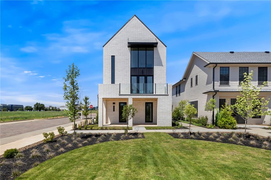 $4000 Preferred Lender Credit! This beautiful home sits in the heart of town, offering an unbeatable location and luxurious living. The new Pinnacle Village Development is just off of Pinnacle Hills Parkway, tucked behind the Walmart Neighborhood Market. Each unit showcases high-end finishes including hardwood floors, 10'ceilings, 8' interior doors, designer lighting and programable thermostat. The open kitchen features quartz counter tops and premium stainless-steel appliances with a gas range. An elevator provides easy access to every level. The bedroom on the bottom level offers complete privacy and can serve as a mother-in-law suite or guest suite. Complete with washer and dryer. The spacious 2-car garage includes an EV outlet. The home is also within walking distance to the Walmart AMP, Topgolf, restaurants, shopping, entertainment and more! Whether you're looking for a personal home or an investment property, this residence offers the best of both worlds.