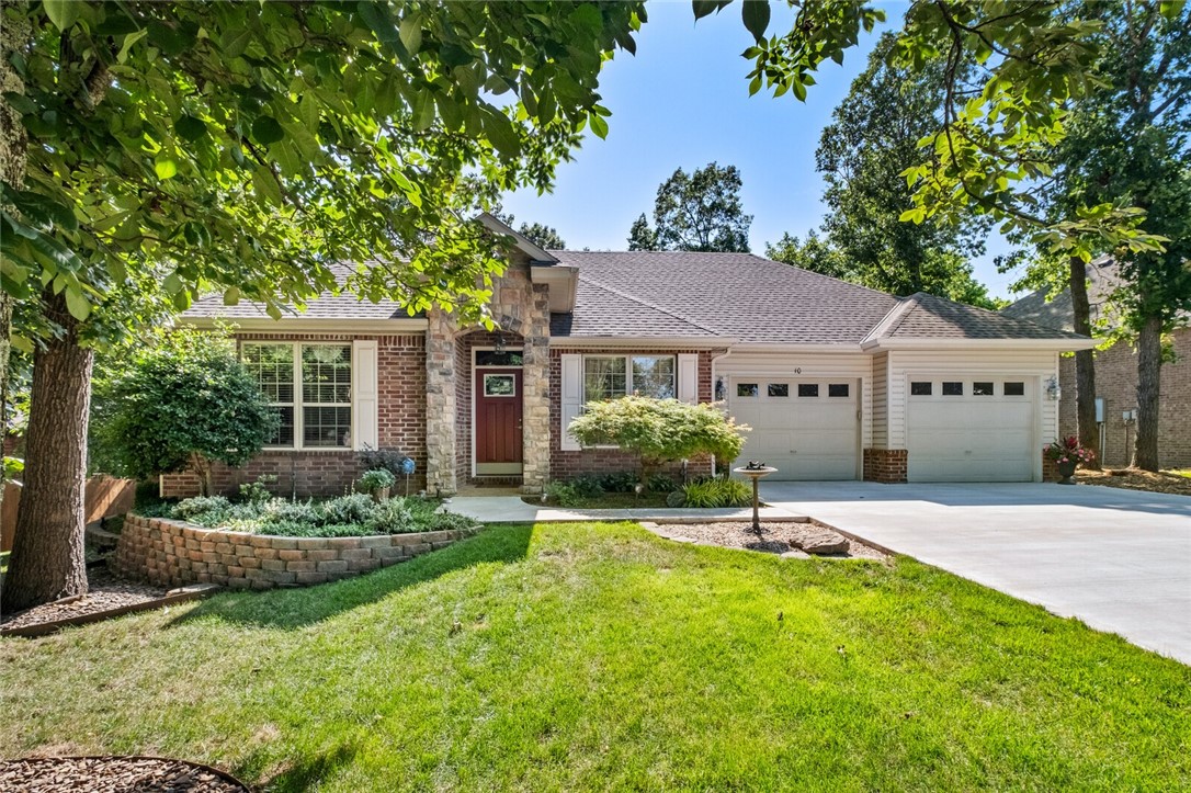 Stunning home that is handicap accessible in a rare much desired neighborhood that has underground utilities, curbed street & sewer. Home is close to Metfield Rec Center & Golf Course, Razorback Greenway, Hiking & Biking Trails, Pool & Pickleball Courts as well as Lake Brittany & Lake Ann. The custom floor plan includes 2 spacious bedrooms & baths with a large bonus room which can be used as office, hobby room or additional sleeping room. There is a formal dining room for those special occasions, or you can choose to eat at the kitchen bar or on the back covered patio. The kitchen has all been updated with farmer's sink, quartz counters, new backsplash, modern appliances, hardwood floors and painted cabinets. Open floor plan from kitchen to spacious living room with gas log fireplace and patio doors leading outside to a beautiful, covered deck, firepit and luscious greenery. Large 2 car garage will fit full size truck Additional 19x8 workshop in garage. See MLS attachment of improvements to property.