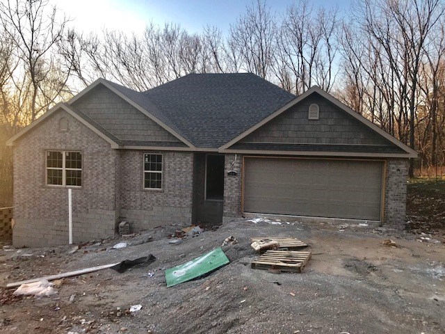 Great new construction in lovely Bella Vista with an easy drive to the highway!! All brick four bedroom, two bath open concept featuring granite countertops, stainless appliances, and wood look tile.