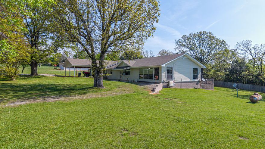 This approx. 7-acre farm located in the Boston Mountains, offering one of the most unbelievable views you’ll find in Mountainburg. Open space, usable land, and a 2,700 sq ft home that was made for country living. The land is fully fenced and offers pasture for grazing or hay. Several outbuildings including: A 2-car carport, A 3-car equipment carport(30X40), A detached work shop(30X40) and An animal pen. The home itself offers space, comfort, and that classic country feel. There’s an option to purchase MLS 1088198, and 1086470 for additional acres featuring a large barn and another gorgeous building site, pond and securing more of this incredible mountain landscape. "If you’ve been searching for a true mountain retreat with room to breathe, this one is something special.” Work from home--Wave internet is available at the street.