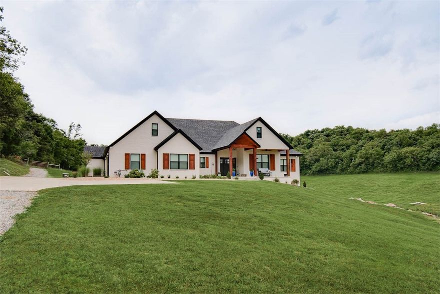 Enjoy the peace and seclusion of this 80-acre prime hunting property, just 11 miles from I-49. Watch deer & wild turkey in the valley below as you take in the sunset from either the front or back porch. 25+ open acres fenced & cross-fenced for cattle, equipped w/frost free water troughs & 2 stock ponds. Property has 3-4 acre established food plot, and a spring fed pond used by the wildlife that flourish here. Main home
features chef’s kitchen w/8-burner gas range, double ovens, built fridge/freezer, industrial vent hood & a huge pantry. Luxurious primary suite w/dual shower, his/her lavatories, large closet w/access to laundry room of your dreams. 16x21 bonus room w/a murphy bed can be 4th BR or bonus room. Guest area w/dressing space, jacuzzi tub, private shower. Energy-efficient, spray foam insulation. Farm also has 1400SF, 2BR/1BA older home w/2 living areas. 30x50 metal shop w/concrete floor & 220-volt electricity. 14x50 RV enclosure. $100k+ value in hardwoods (report attached) Also Listed as Land MLS# 1296914