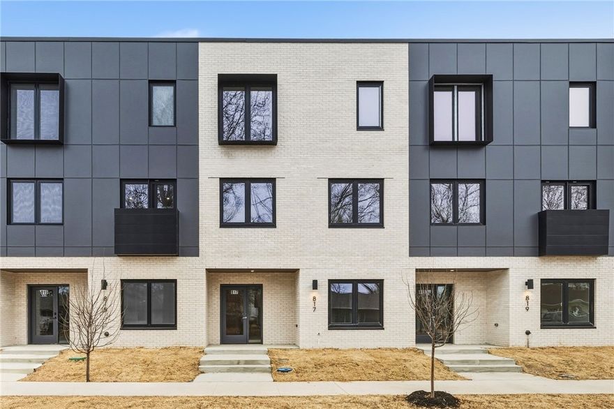 Do you want to walk to work?  Do you like live music?  Experience the very best of downtown Bentonville living at LIGHTBOX. Perfectly positioned in the new heart of Bentonville, these industrial-inspired townhomes put you steps from the Walmart Home Office, 8th St. Market, and The Momentary.  
The "Soft Light" floor plan is an architectural standout, featuring a clerestory design that harvests natural light from above. Inside, a sculptural floating steel staircase serves as a functional piece of art, grounding the home’s bold, modern character. This expansive residence offers four large bedrooms and thoughtfully designed baths, plus a dedicated office and a top-floor flex lounge for versatility.
The primary retreat is a sanctuary of its own,  a European-style wet room, floating vanity, and dual closets. From the oak-clad kitchen with pro-grade induction cooking to the community fire pit for evening social hours, Lightbox isn’t just a home—it’s a lifestyle statement.