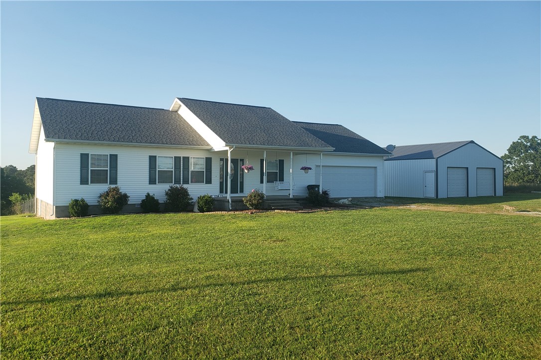 Charming home in Oak Grove sitting on 2.13 acres with a view! 4 bedroom and 2 bath home with a split floor plan. You will feel right at home with the large living area, beautiful kitchen, and a dining room with french doors that lead to the back deck where you can sit enjoy the gorgeous view of the country side. Spacious master bedroom! Ensuite master bathroom boasts a huge walk-in closet and a jetted tub. More than enough room to park your vehicles and your toys with in the large, 2 car garage and the double door, 32x32, metal shop building. This home is in a beautiful and peaceful area and is ready for you to move right in!