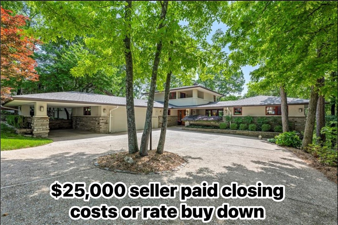 Discover luxury & tranquility at this exceptional, recently refreshed custom prairie-style home on the pristine shores of Lake Ann in beautiful Bella Vista. Located 220 yards from the Back 40 Trail, 10 min. to Bentonville & 20 minutes to the new Walmart Campus! This rare offering presents a unique opportunity to own a slice of paradise, meticulously crafted with the finest materials & showcasing great attention to detail. Recently landscaped grounds & refinished floors complement the home's already impressive features. Walls of windows frame breathtaking lake views & fill the home with natural light. Indulge in a wealth of high-end amenities: rich hardwood floors, elegant travertine tiles, natural stone accents, a private lakeside bungalow, chef's-grade appliances, a convenient motorized lift for effortless access to lake, & an add'l 500sf for a home office or craftroom. Experience the ultimate in lakeside living at this remarkable estate. **SELLER TO CREDIT BUYER UP TO $25k IN CLOSINGS COSTS OR RATE BUY DOWN.**