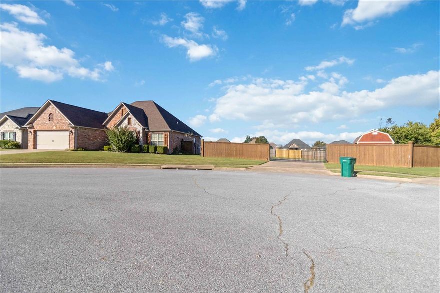 3BR/2.5BA split-floorplan home on a level 0.45-acre double lot in a cul-de-sac. Mostly brick exterior with hardwood floors, crown molding, and a gas fireplace. The kitchen includes granite counters, stainless steel appliances, and a gas range. The primary suite features a tray ceiling, a jetted tub, dual vanities, a separate shower, and a walk-in closet. Fully fenced backyard with covered patio and storage shed. Tile in wet areas, a separate laundry room, and a 2-car garage.