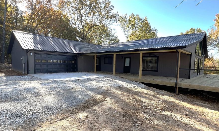 Brand NEW Construction with a fantastic VIEW!!  This 4 BR, 3 BA, 2,186 SQFT, CH&A, 2 car oversized garage, covered porch (12' x 40'), open deck (20' x 44'), and 1.35 acres m/l. The home features a large great room, cathedral ceilings, large windows overlooking the view, metal roof, rural water, and two master suites. If you are looking for a new home in the country this is one you ought to take a look at. Schedule a viewing today!