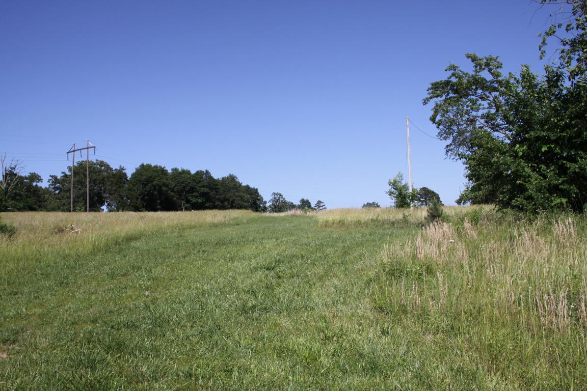 Great Location! 13 acres with barn on a paved road with Rural Water & Natural Gas!