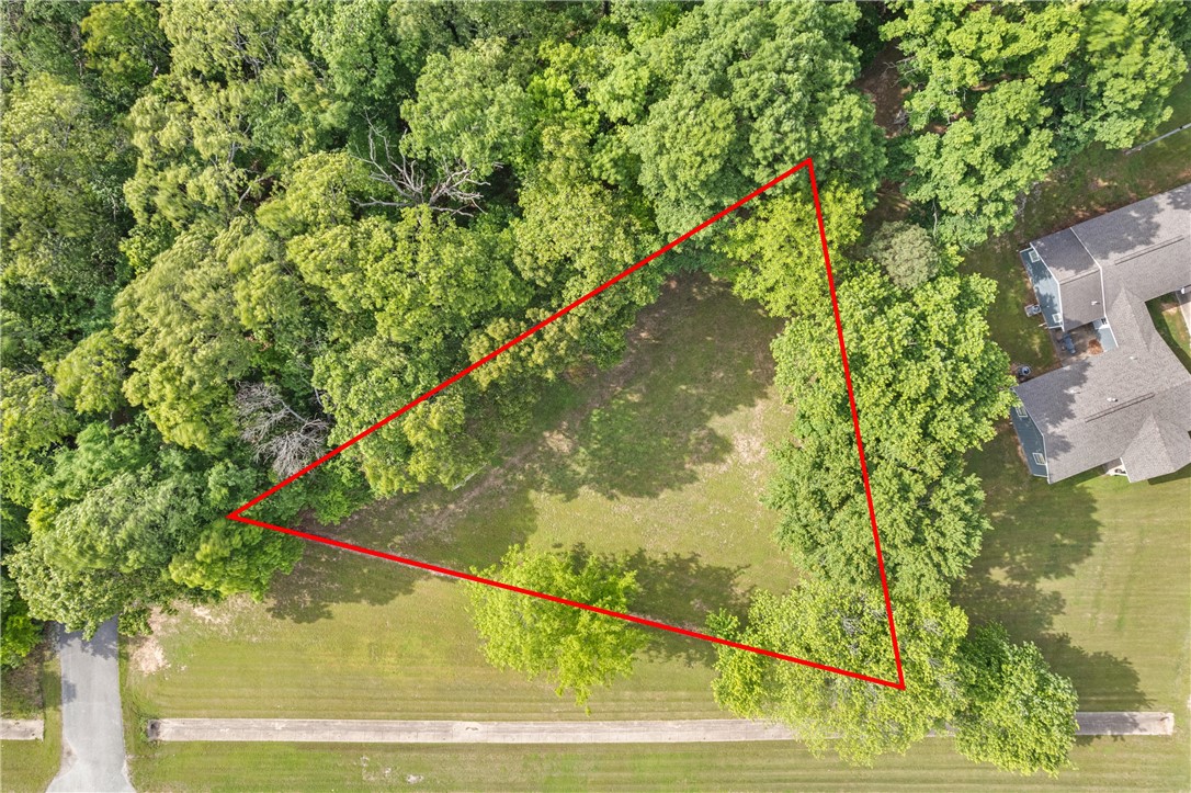 This Springdale lot offers a unique chance to invest in an area poised for continued expansion. Featuring direct highway frontage on 412, the property delivers outstanding access and visibility. Whether you’re looking to build a dream home with room to roam or simply hold the land as a long-term investment, the options here are truly wide open. The setting combines the tranquility of country living with the convenience of major highway access—truly the best of both worlds.