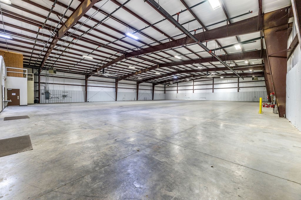 20'9" sidewalls with 24'9" clear ceiling height on 2 acres. Wagon Wheel Frontage, 2 docks and 2 drive through doors. 3,700 SF office space, 13,300 square feet warehouse space. Brochure in Supplements.