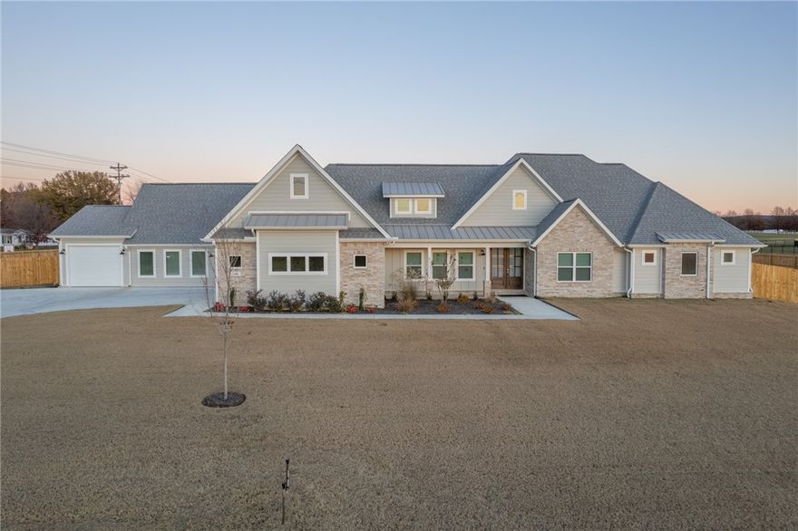 Gorgeous new home located just outside of Farmington. Home features beautiful finishes and tons of storage. Kitchen features custom built cabinets and quartz countertops. Luxury vinyl plank throughout with herringbone tile flooring in primary bath. Included in square footage is mother-in-law suite with 1 BR/1 BA, kitchenette with microwave, sink, and beverage fridge, plus a 1-car garage.